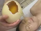 Nude Japan babe has huge ostrich egg emptied on face