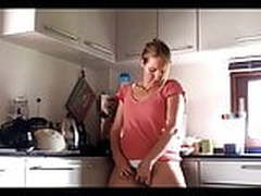 Stunning milf masturbating in kitchen