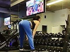Ariel Winter lifting a weight and dancing in the gym