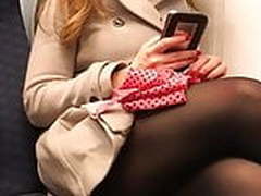 Black pantyhose legs on London train