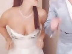 Young English actress dancing, showing cleavage. 