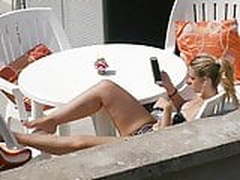 Blond girl in underwear on the terrace